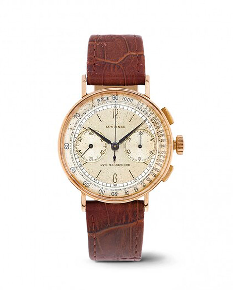Watches and More_Orologio cronografo vintage Longines con cinturino in pelle marrone.